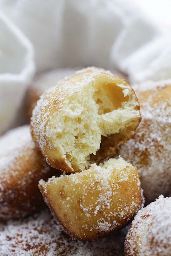 Easy homemade Portuguese donuts torn in half.