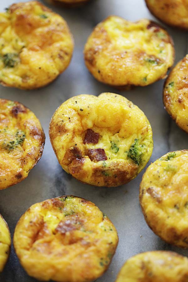 Healthy baked breakfast Starbucks egg bites with fresh broccoli, crispy bacon and eggs.