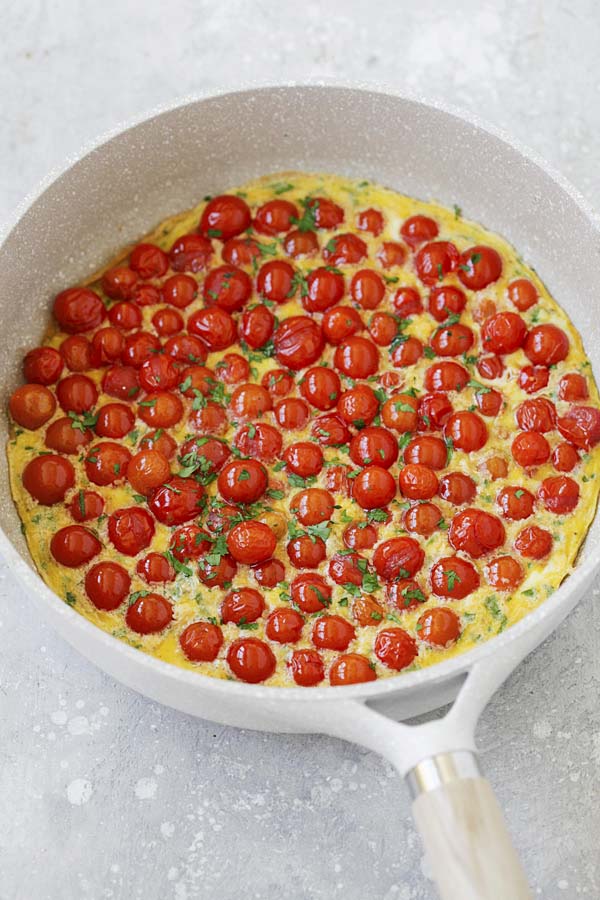 Cherry tomato frittta in a skillet.