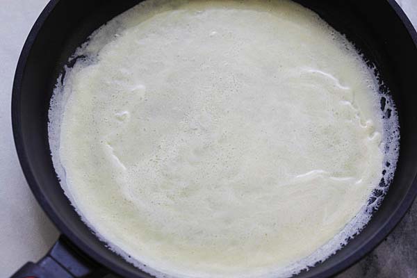 Making French crepes with a non-stick skillet.