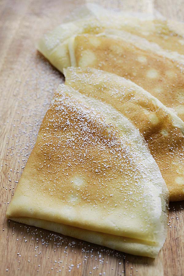 French crepes pancakes dusted with powdered sugar.