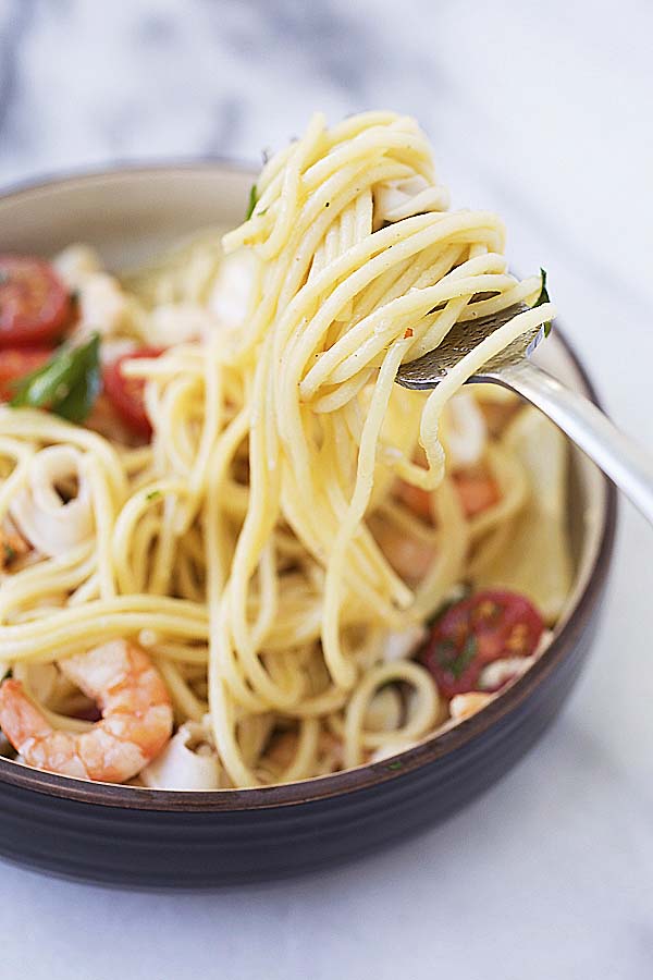 Close up of spaghetti pasta with seafood scampi.
