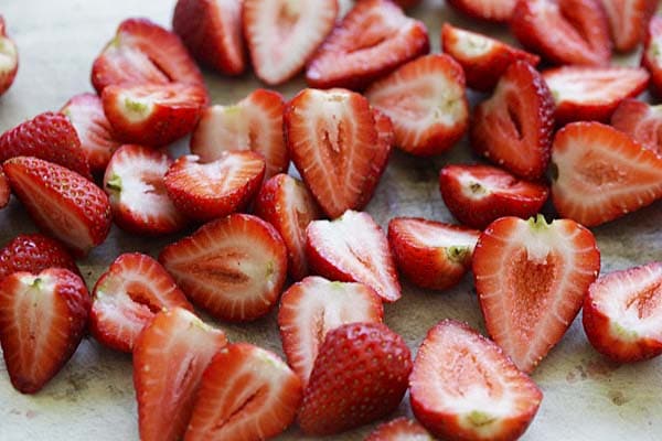 Hulled and halved strawberries