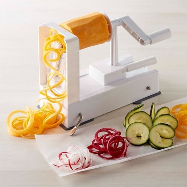 Making zucchini noodles or zoodles using a spiralizer.