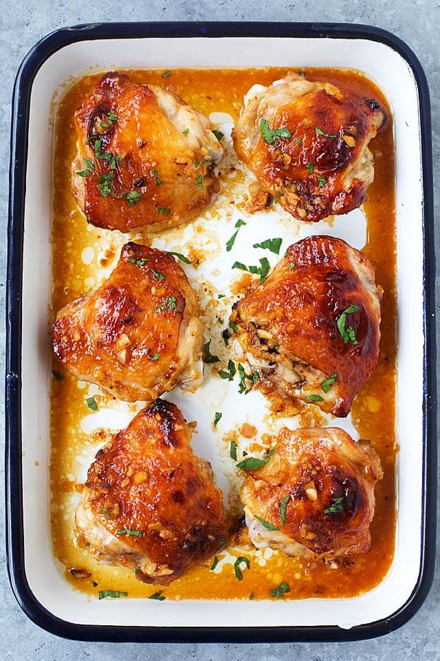 Easy and quick Honey Garlic Baked Chicken in a baking pan.