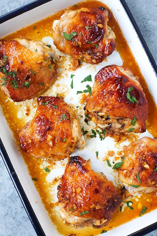 Perfectly baked chicken thighs with golden brown skin, with honey and garlic.