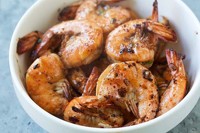 Easy garlic sauteed shrimp for garlic noodles, served in a bowl.