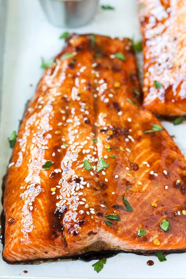 Close up picture of healthy homemade baked salmon with a sticky and dark soy glaze.