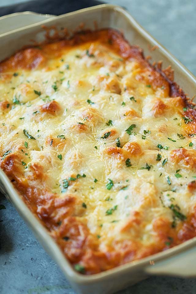 Cheese baked tortellini casserole in a baking dish, ready to be served.