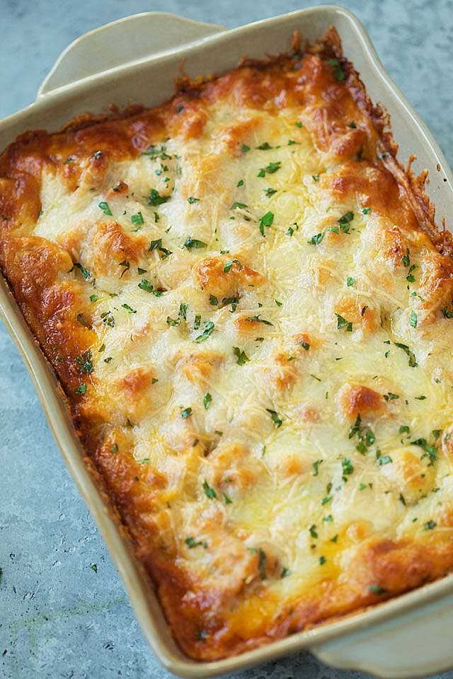 Baked Tortellini topped with cheese.