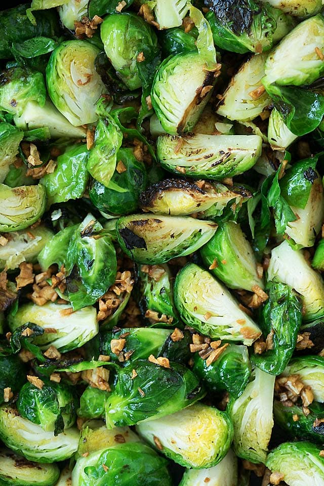 Close up shot of pan fry brussels sprouts in a cast-iron skillet.