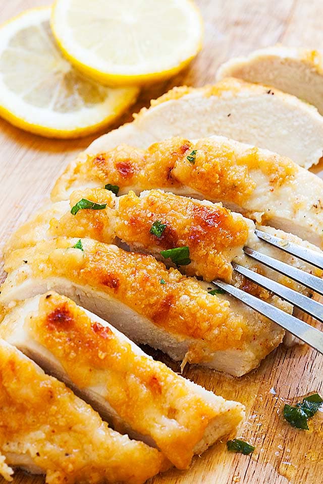 Chicken breast recipes with baked chicken breasts topped with Parmesan cheese.