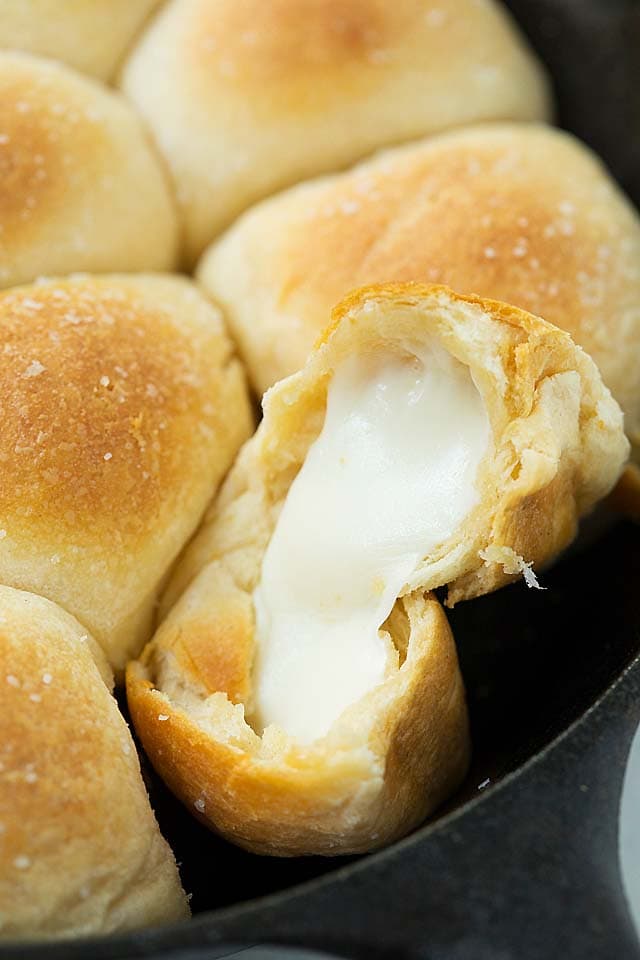 Cheese bombs with hot and melted mozzarella cheese strings oozing out.