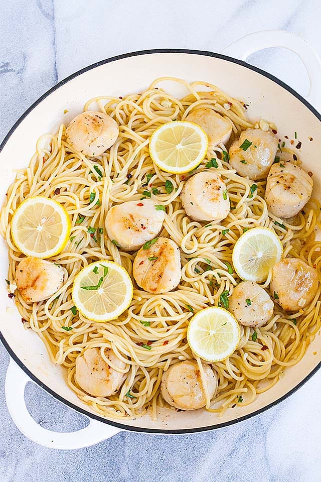 Sea scallop pasta in creamy scallop cream sauce in a skillet.