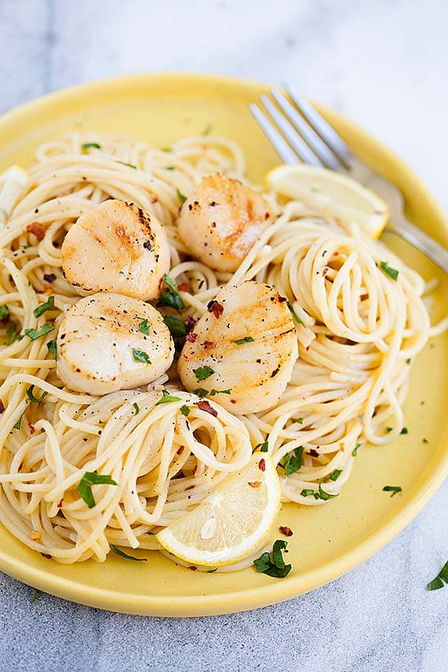 Creamy garlic scallops pasta on a plate.