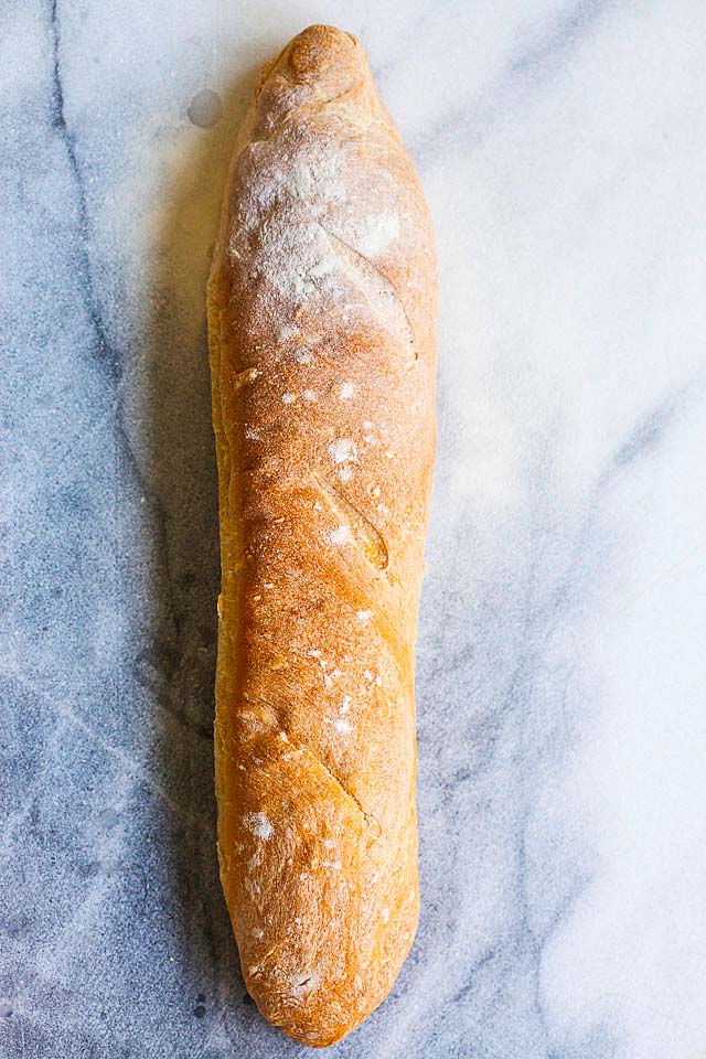 Baguette is a French bread that is shaped like a log with a crispy crust.