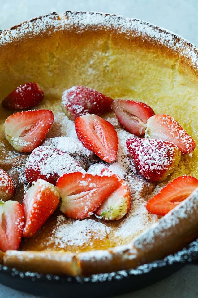 German pancake or dutch baby in a cast-iron skillet, ready to be served.