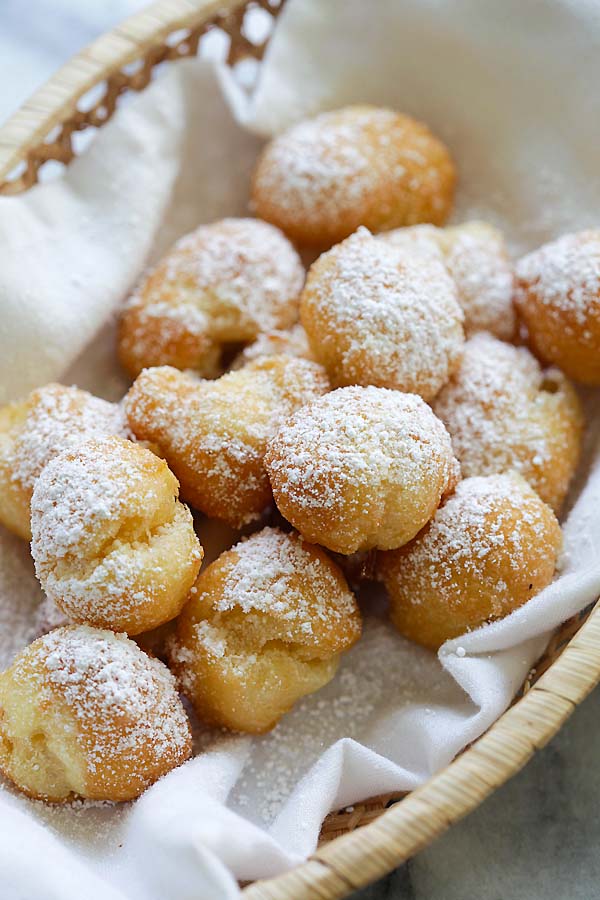 Soft, puffy, pillowy and crazy delicious beignets that transport you to New Orleans. Easy homemade beignets recipe with a choux pastry batter and powdered sugar!