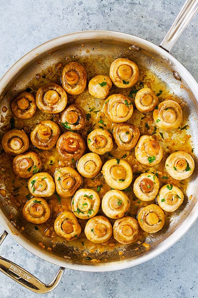 Garlic butter mushrooms in a skillet, ready to serve.