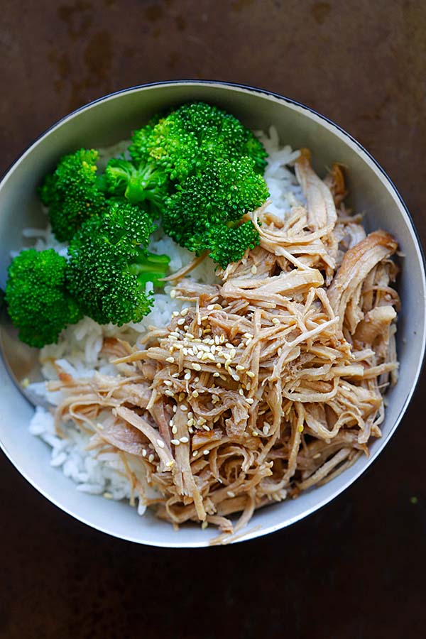 Hawaiian Kahlua Pork shredded and ready to be served with steamed rice and broccoli.