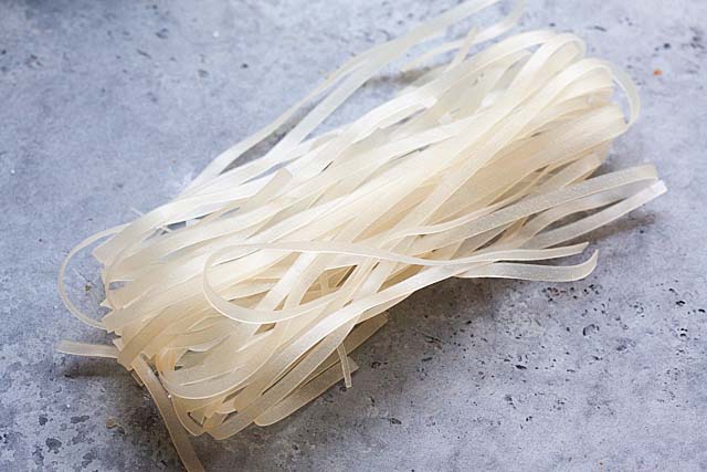 Dry rice stick noodles for Drunken Noodles Pad Kee Mao. 