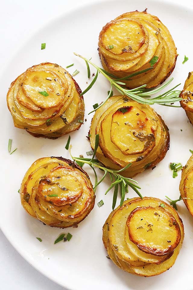 Top down picture of roasted potato stacks with rosemary herb.