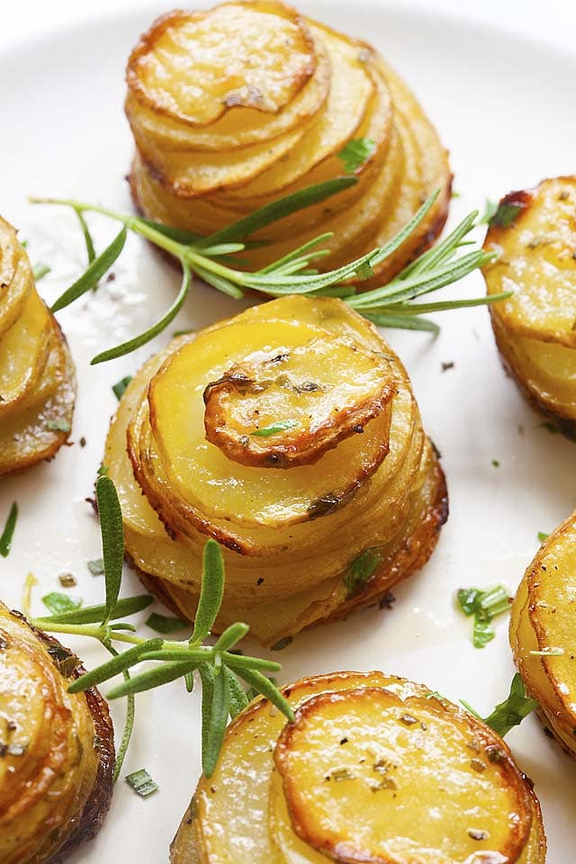 Sliced potatoes stacked up and baked to crispy perfection and golden brown in color.