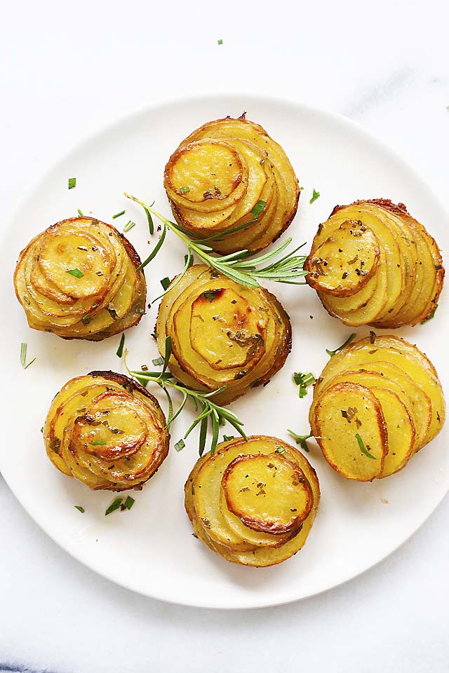 Crispy potato stacks on a white plate, ready to serve.