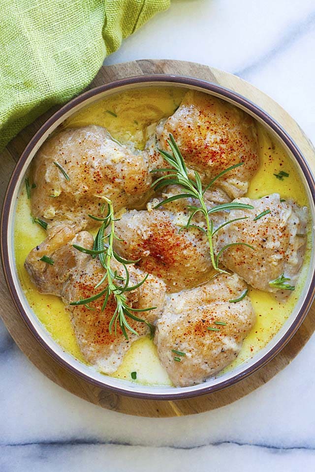 Instant pot chicken thighs with creamy garlic sauce in a dish, ready to serve.