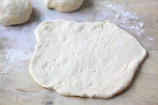 Naan dough on a floured working surface. 