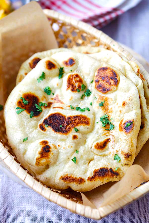 Close up photo of a piece of naan bread. 