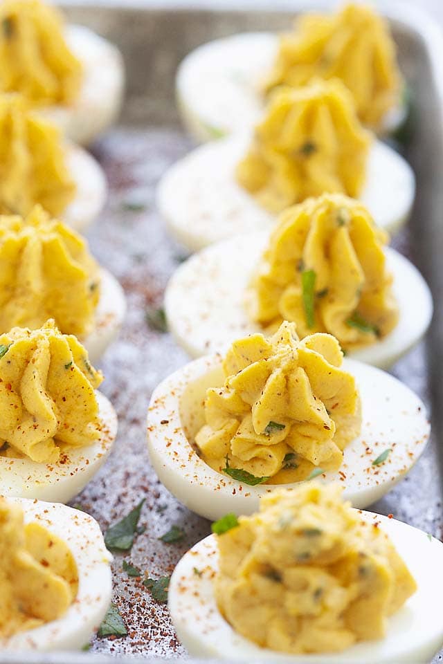 Sriracha devilled eggs dusted with paprika.