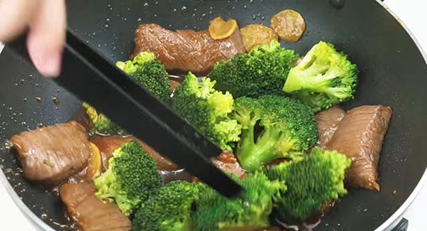 Stir fry the beef, broccoli florets and brown sauce.