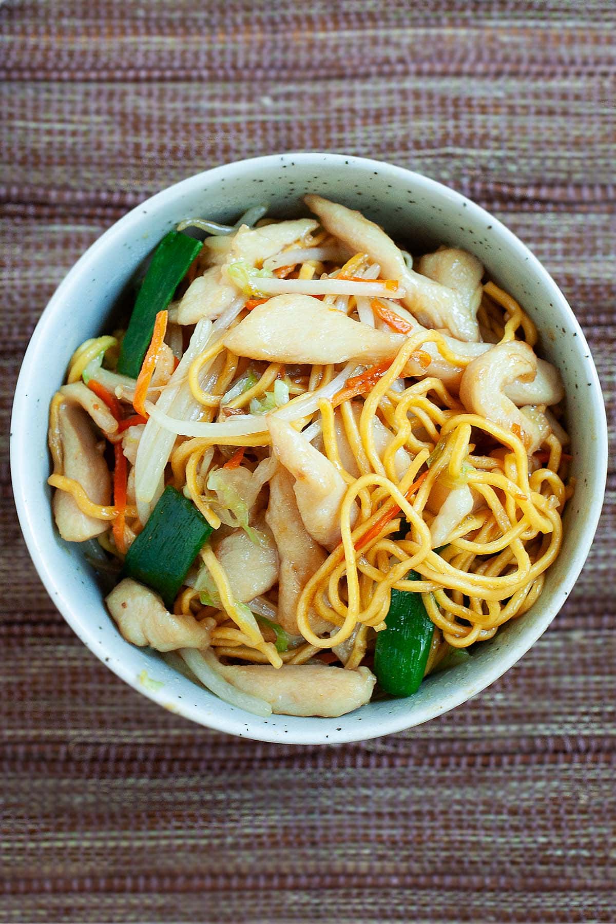 Chicken chow mein with soft egg noodles in a bowl. 