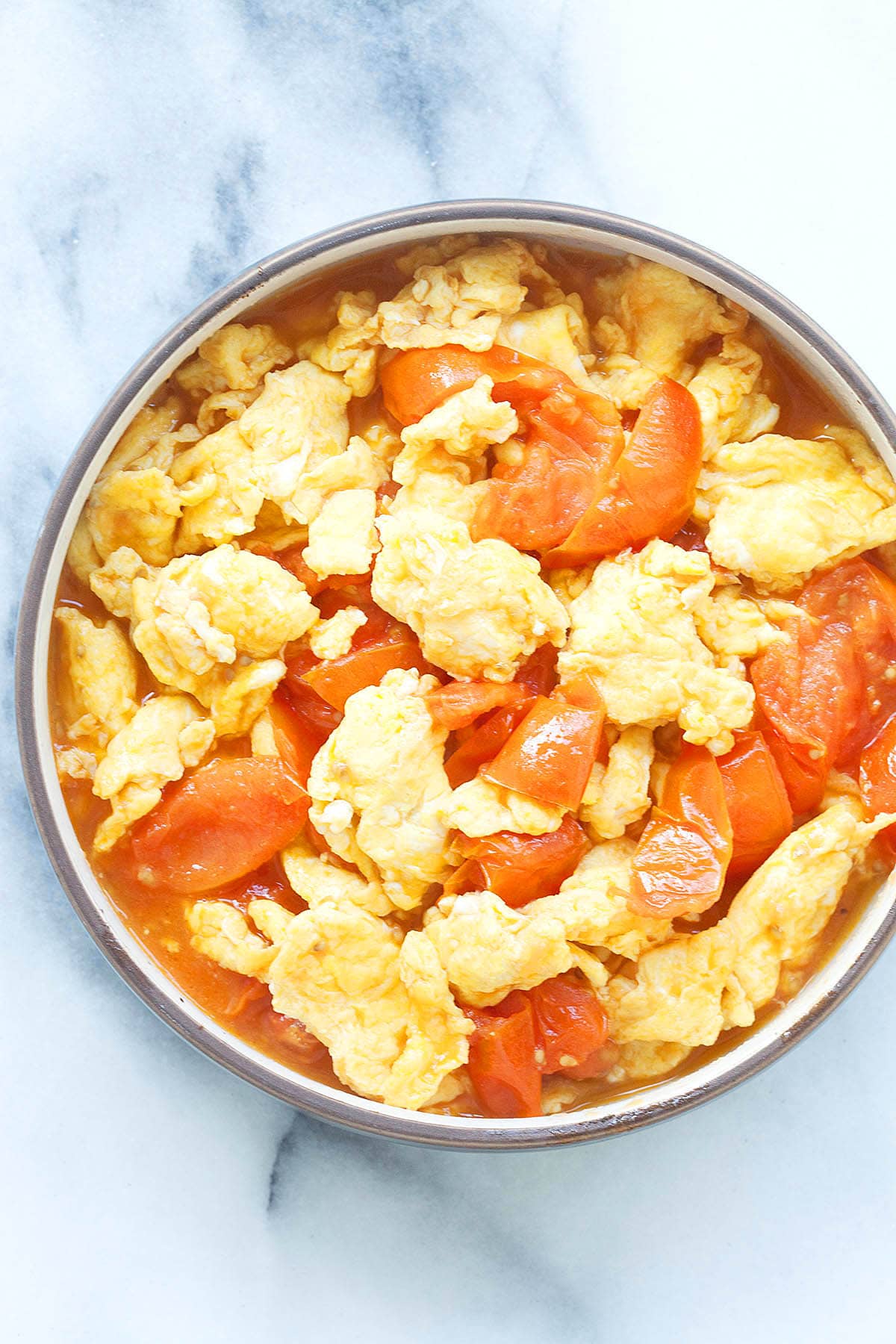 Chinese tomatoes and eggs served in a bowl.