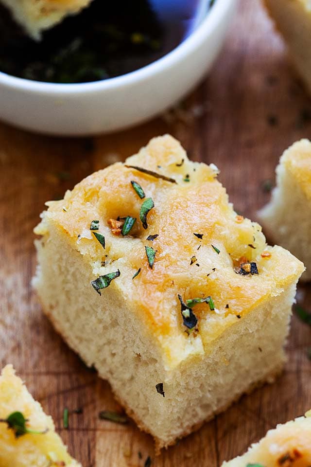 Focaccia bread recipe with toppings of rosemary, oregano and sea salt flakes.