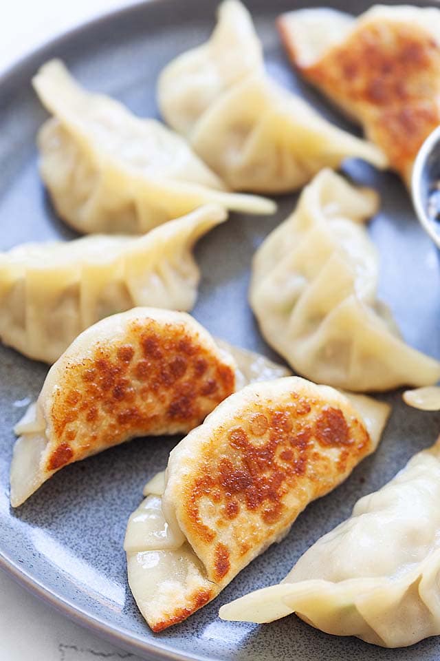 Potstickers from scratch with ground pork filling and potsticker sauce.