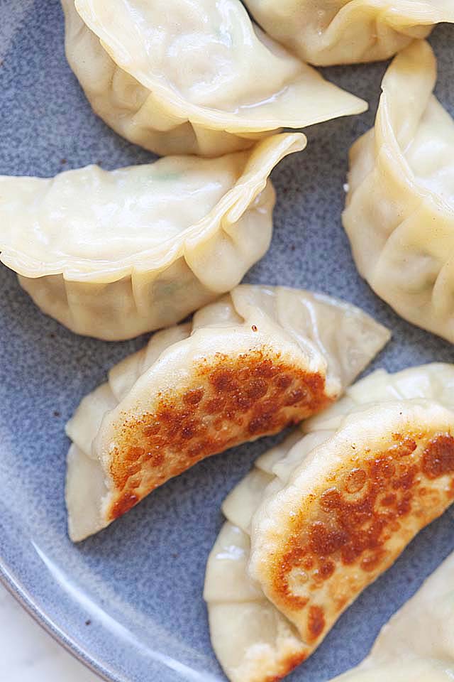 Crispy homemade potstickers 'guotie' served on a plate.