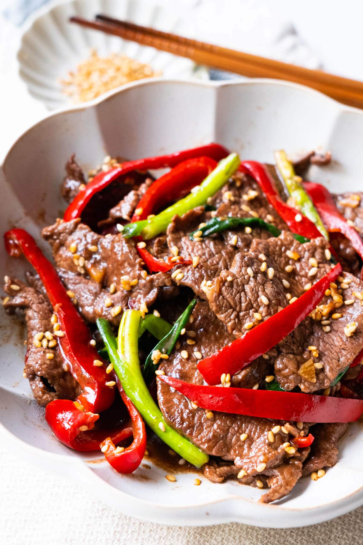 Easy and delicious beef stir-fry with soy sesame brown sugar sauce in a bowl.