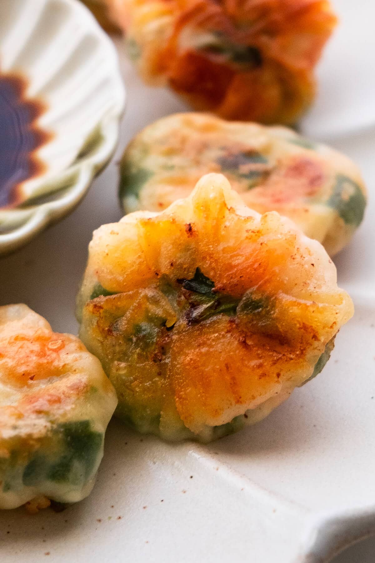 Dumplings with shrimp and chives filling on a plate.