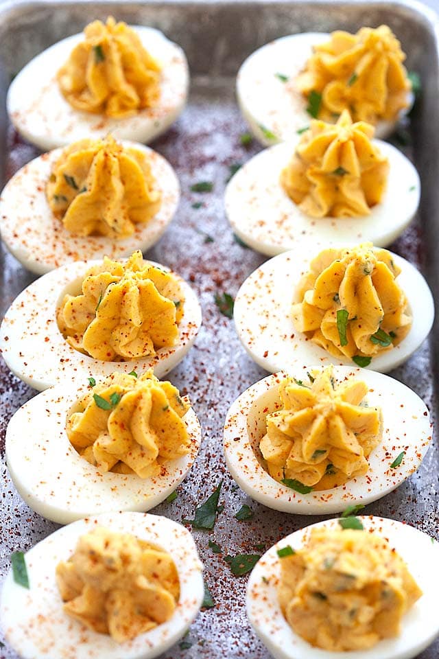Deviled eggs in a row, ready to be served.