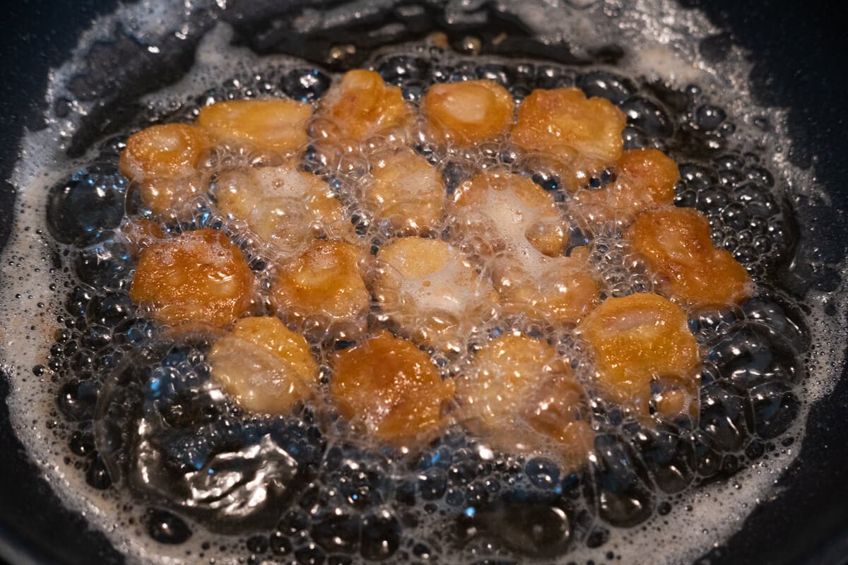 Deep-frying pork tenderloin in a pan. 