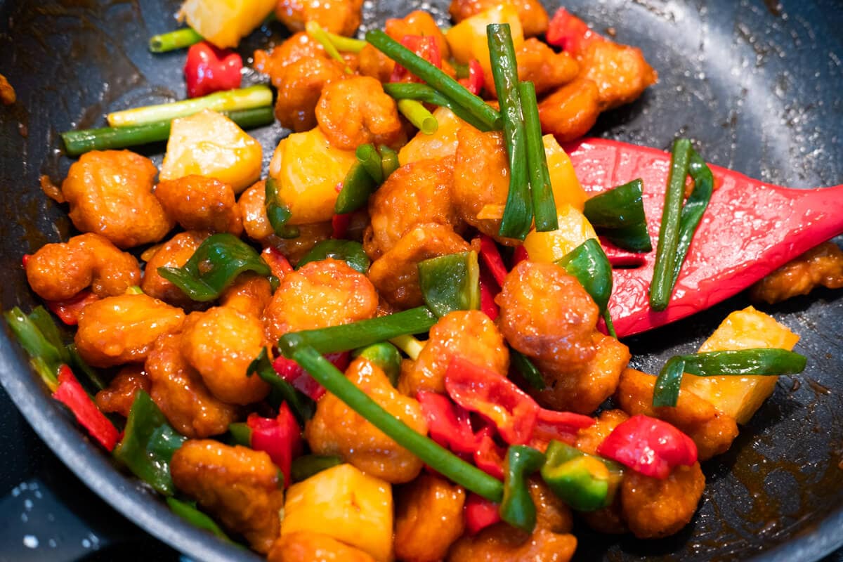 Sweet and sour pork in a pan, ready to serve. 