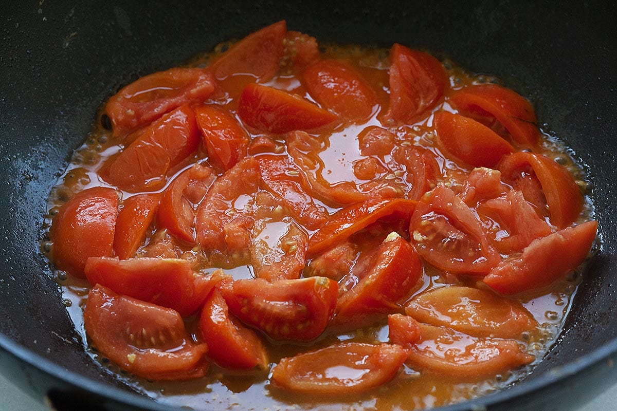 Cooking tomatoes for tomatoes and eggs recipe.