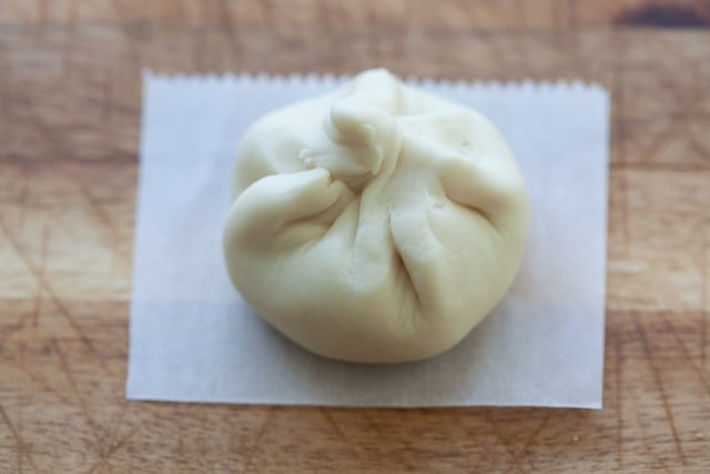 Wrapped char siu bao ready for steaming.