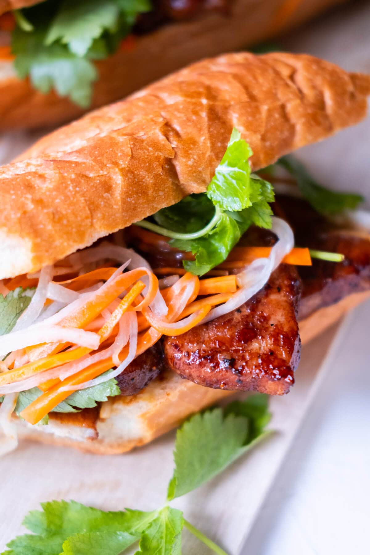 Vietnamese pork sandwich recipe with grilled pork marinated in lemongrass sauce. 