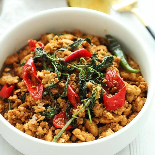 Spicy Thai chicken basil with red chilies and Thai basil.