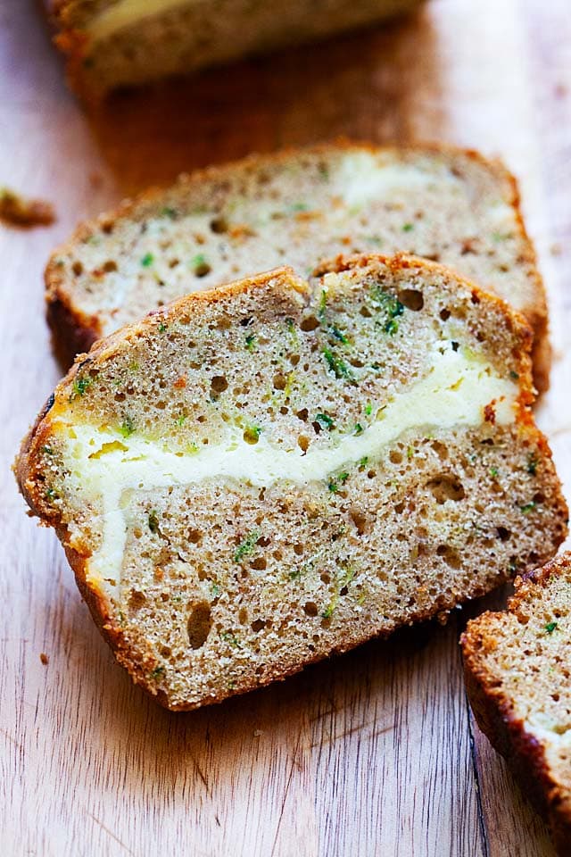 Two slices of cheesecake zucchini bread.