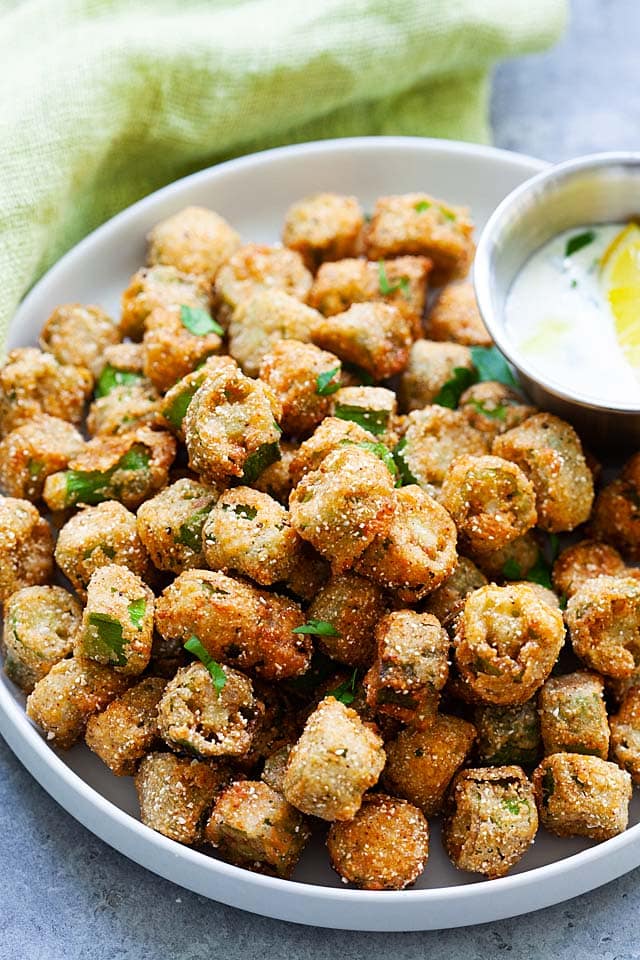 Fried okra on a white plate, ready to serve.