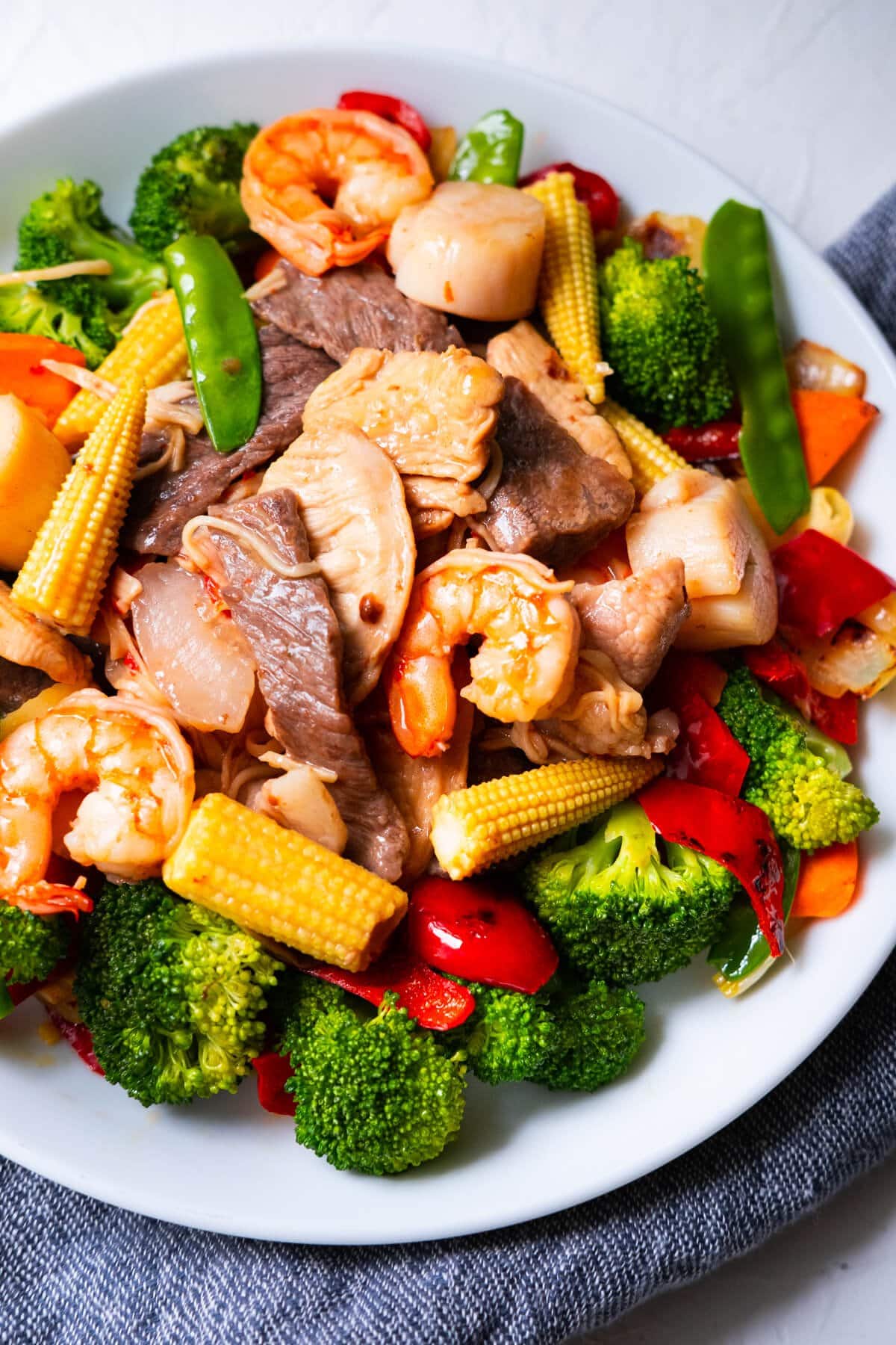 Easy and delicious homemade takeout style happy family stir fry served in a plate.